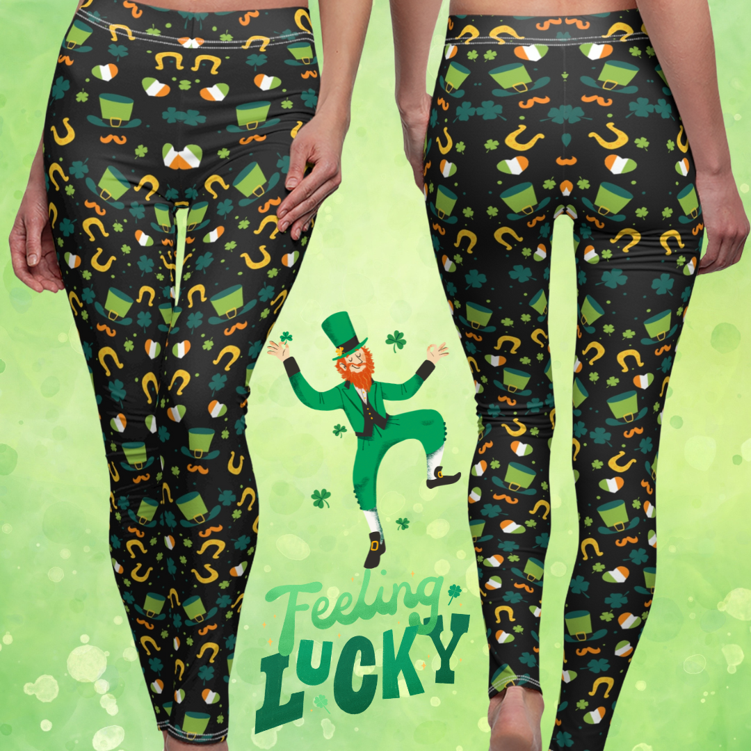 Two women wearing black leggings with St. Patrick's Day-themed patterns, including leprechauns, shamrocks, and horseshoes. The background is green with a cartoon leprechaun and the phrase "Feeling Lucky.