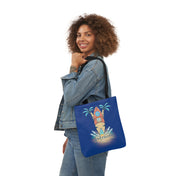 A person with curly hair wears a denim jacket and jeans, holding a Surf's Up Good Vibes Only Beach Tote by Printify with a beach-themed design featuring surfboards, palm trees, and water splashes that says "Just chillin' out." They are smiling and looking over their shoulder, ready to express yourself.