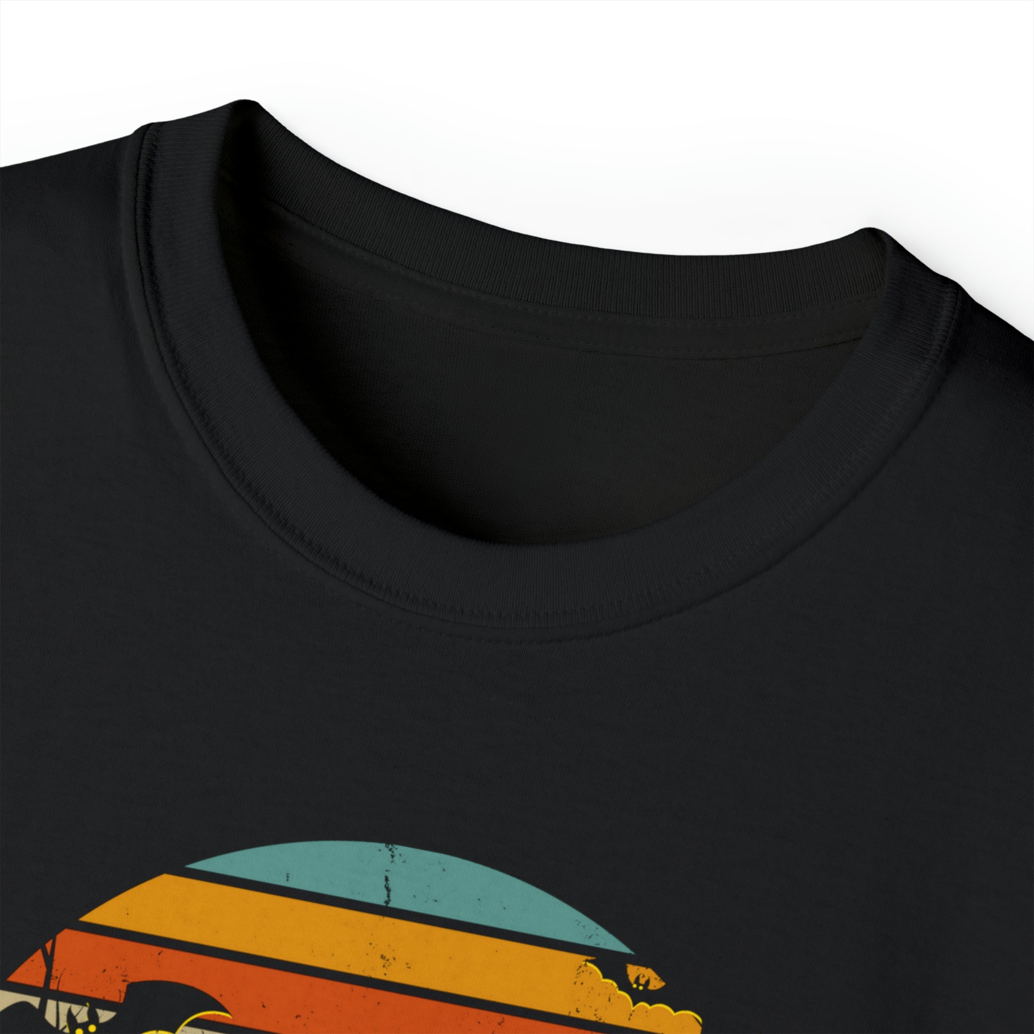 A close-up of the neckline of a Spooky Nights Halloween Ultra Cotton Tee (Unisex) by Printify. The shirt features a partial graphic design with retro-style stripes in blue, orange, and yellow. The image captures the texture and seamless stitching around the collar, embodying artistic expression.