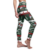 A person wearing Urban SoulShine & co's Tis' the Season To Be Jolly Gnome SuperSoft Casual Leggings, which evoke the charm of an ugly Christmas sweater with playful snowmen, snowflakes, trees, and geometric patterns in bright red, green, and white. Their toes are pointed gracefully as they stand against a pristine white background.