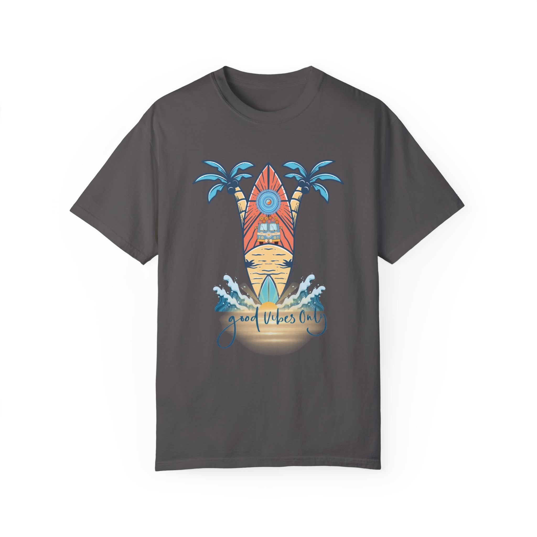 A charcoal gray T-shirt with a design featuring a surfboard in front of two palm trees. The surfboard has a sun and wave pattern, embodying artistic expression. Below the surfboard and palm trees, the text reads "Good Vibes Only." Waves decorate the bottom of the design. The product is named Surf's Up! Good Vibes Only Tee (Unisex) by Printify.