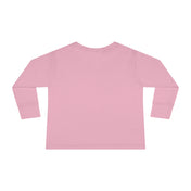 The image depicts the back view of a Printify Too Cute To Spook Halloween Toddler Long Sleeve Tee (unisex Tot) in a solid light pink color. The shirt has a plain design with a crew neckline and ribbed cuffs. It invites artistic expression and dares to inspire, featuring no visible logos or markings.