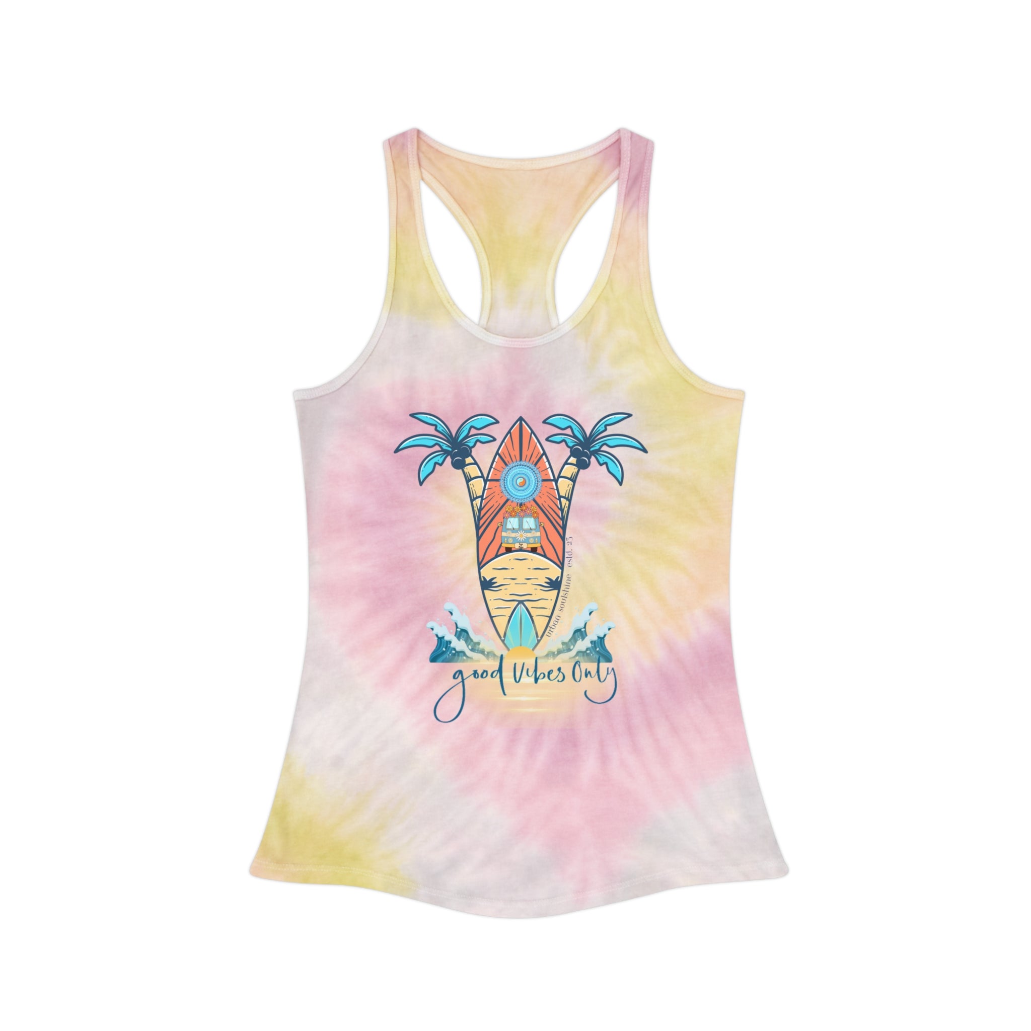 A person with long hair is wearing the Surf's Up Good Vibes Only Tie Dye Racerback Tank Top, made from lightweight fabric and featuring a graphic of a surfboard and palm trees with the message "Good Vibes Only" on the front. They are also dressed in light blue jeans from Urban SoulShine & co and are smiling at the camera.