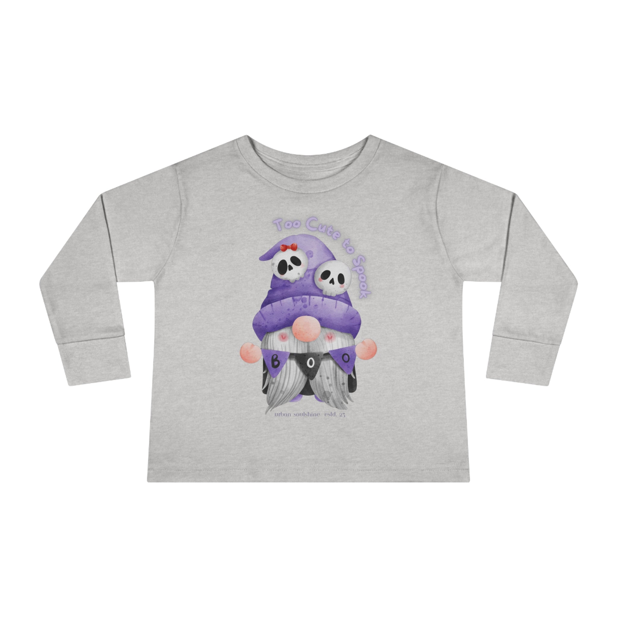 This light gray, long-sleeved toddler shirt showcases an artistic expression with two gnomes in purple and black Halloween costumes, each wearing hats with skulls. The text above reads "Too Cute to Spook" and below reads "BOO," surrounded by pink and purple bubbles. This is the **Printify Too Cute To Spook Halloween Toddler Long Sleeve Tee (unisex Tot)**.