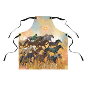 The Sunrise Horse Run Apron by Printify, with an image depicting a herd of horses running through a field, captures the essence of artistic expression. The background has a soft, dreamlike quality with pastel colors and a glowing sun. The apron features black straps for tying around the waist and neck.