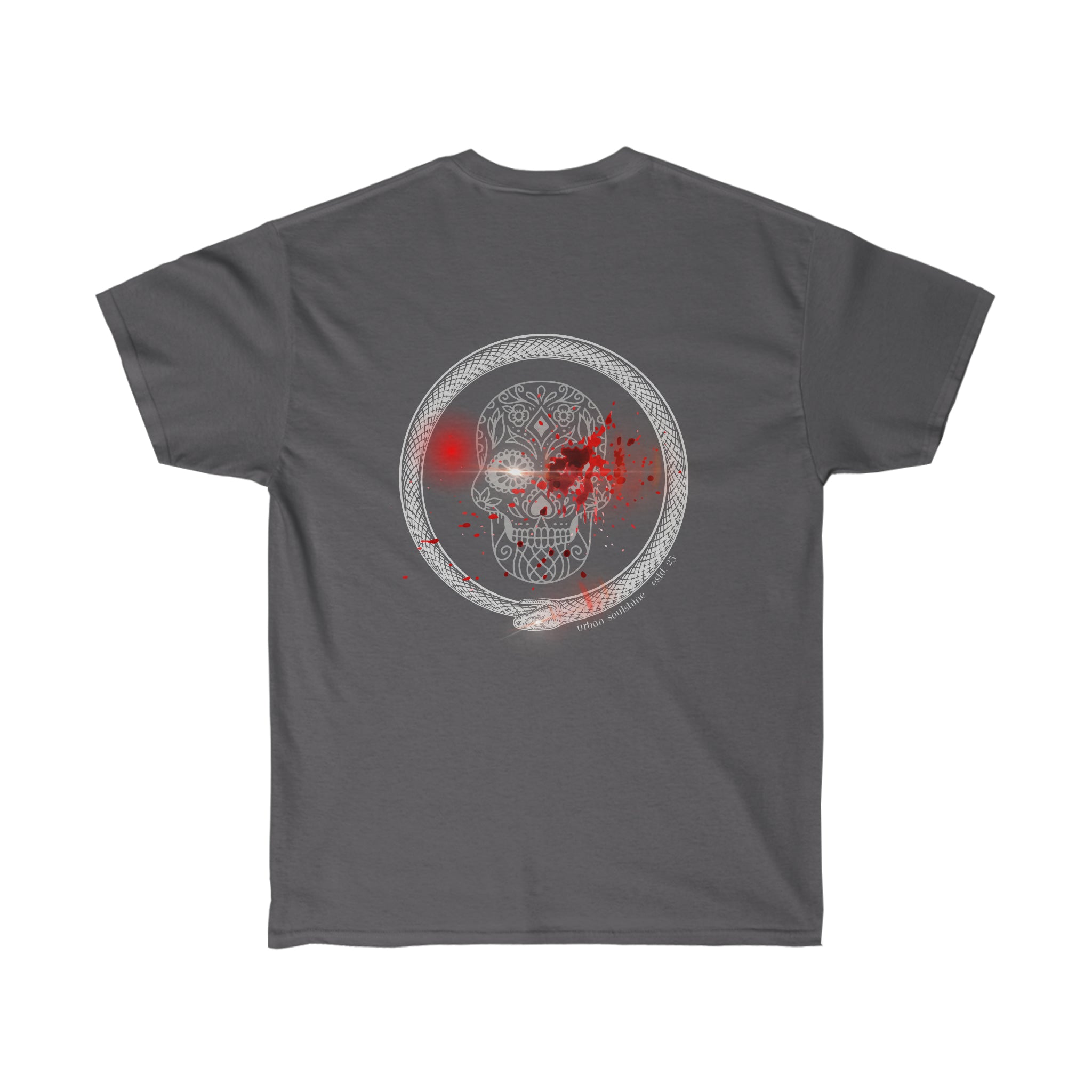 The image shows the back of a dark gray, unisex Serpent Splatter Skull Tee with a circular design featuring an intricate pattern surrounding a central skull. There are red splatter details on and around the skull, making it one of our standout skull designs. This tee from Urban SoulShine & Co is also sustainably sourced.