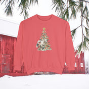 The Gift of A Horse Christmas Garment-Dyed Sweatshirt by Urban SoulShine & co, a unisex piece, is displayed hanging outdoors. Its festive design showcases a horse illustration within a Christmas tree motif. The backdrop features a snow-dusted scene with a red barn and evergreen branches, enhancing the relaxed fit vibe of this unique garment.