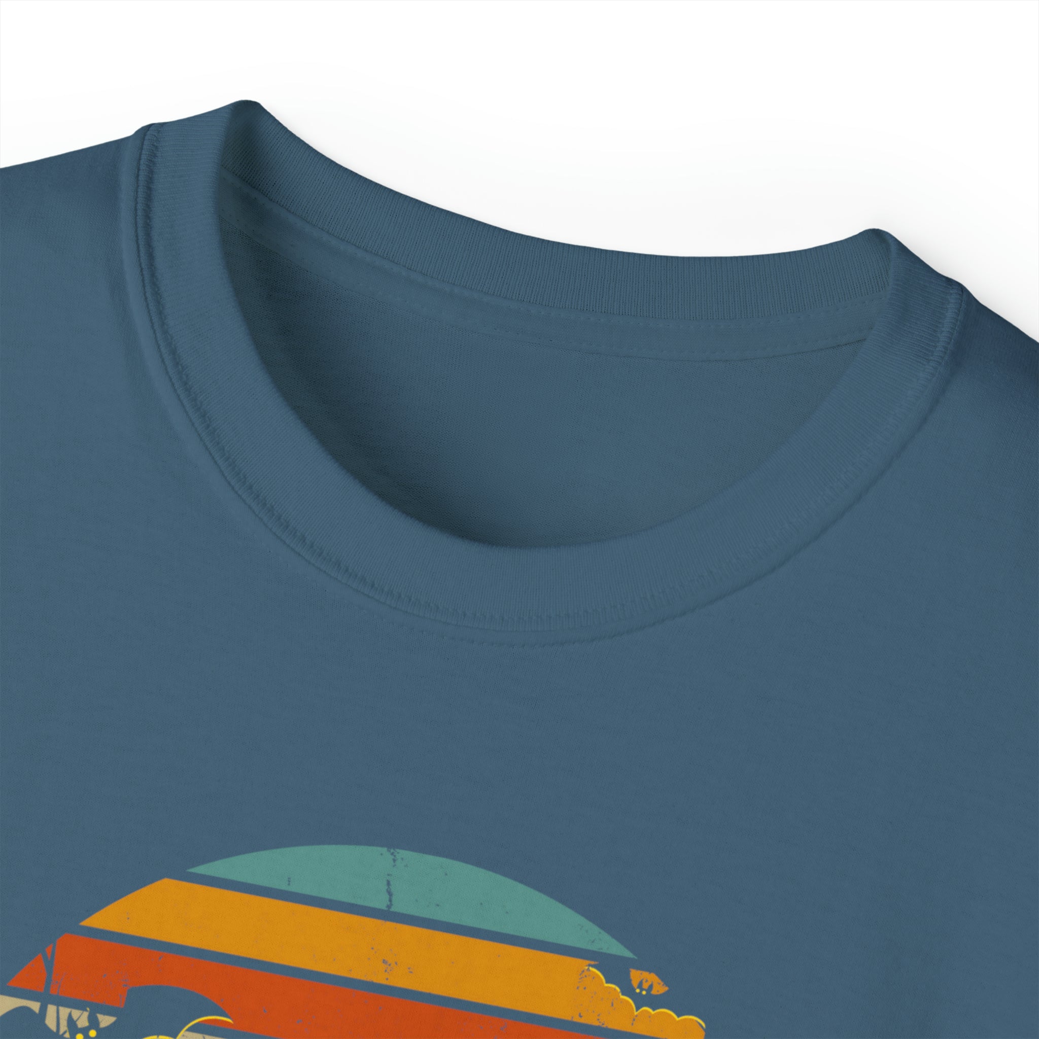 Close-up of a dark blue crew neck t-shirt with a vintage-style design featuring a semi-circle of color bands in orange, yellow, blue, and green. Only the upper half of the design is visible in the image. This Spooky Nights Halloween Ultra Cotton Tee (Unisex) by Printify encourages you to express yourself with style.