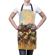 A person stands wearing a white shirt and an apron that features a vibrant design of galloping horses in a field with a stylized sun and mountain in the background. The Sunrise Horse Run Apron by Printify, epitomizing inspirational wear, has black neck and waist straps. The person is posing with their hands on their hips, ready to express yourself.