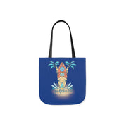 An artistic expression, the Surf's Up Good Vibes Only Beach Tote showcases a sunset over a beach with a surfboard, palm trees, and ocean waves. The phrase "Good Vibes Only" is elegantly written below the design. The bag has black handles and is by Printify.