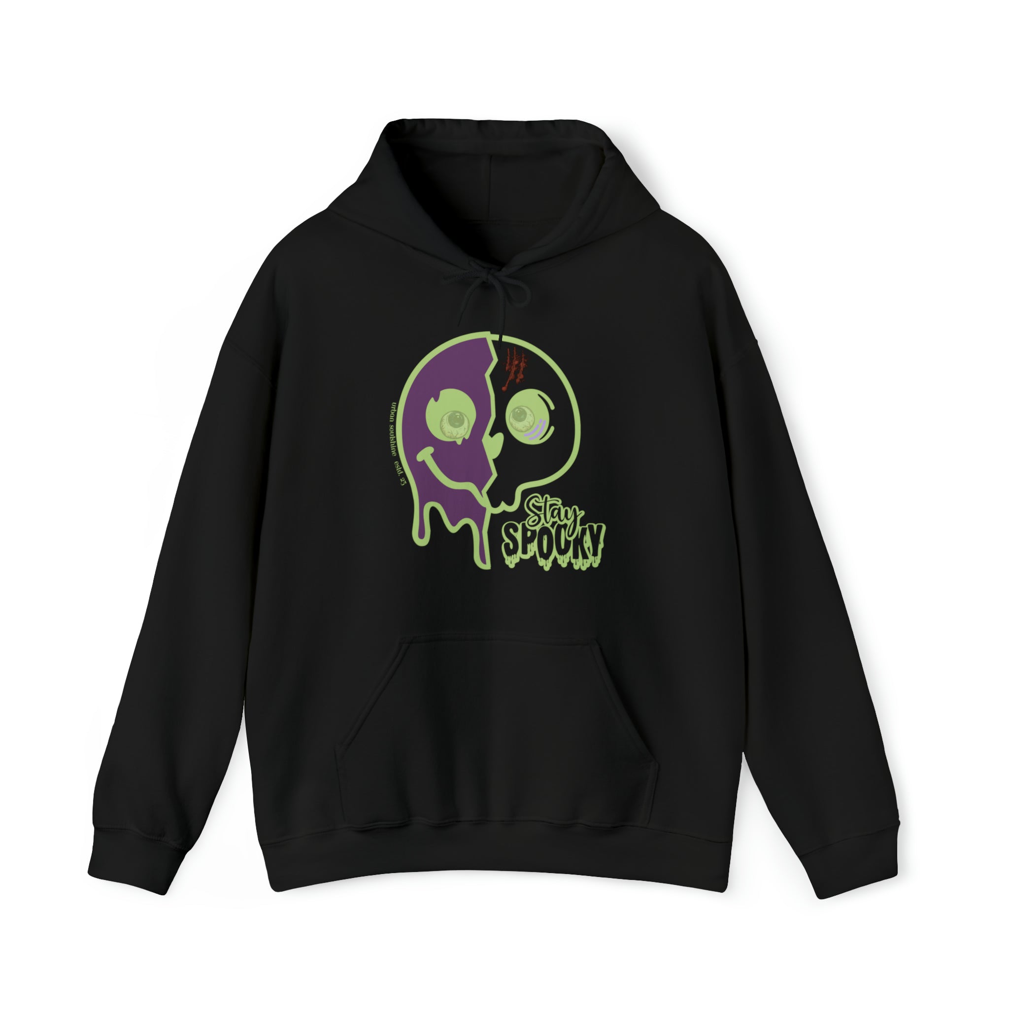 A black Stay Spooky Funky Faces Halloween Hoodie (unisex) by Printify featuring a graphic design of a melting, two-toned face with one side purple and the other green. The face has two eyes and a stitched mouth, along with the words "Stay Spooky" in green near the bottom. Perfect for those who love to express yourself through artistic expression.