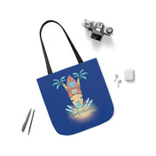 A Surf's Up Good Vibes Only Beach Tote by Printify, with black handles featuring an illustration of a surfboard against a sunset and palm trees, with the text "Good Vibes Only." The bag is surrounded by a camera, earbuds, and a pair of mechanical pencils on a white surface. Perfect for expressing yourself through artistic expression.