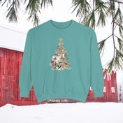 Introducing "The Gift of A Horse Christmas Garment-Dyed Sweatshirt" by Urban SoulShine & Co—a unisex teal sweatshirt that showcases a white horse alongside a decorated Christmas tree. The design is completed with a snowy landscape, red barn, and pine branches, offering a relaxed fit that's perfect for cozy winter days.