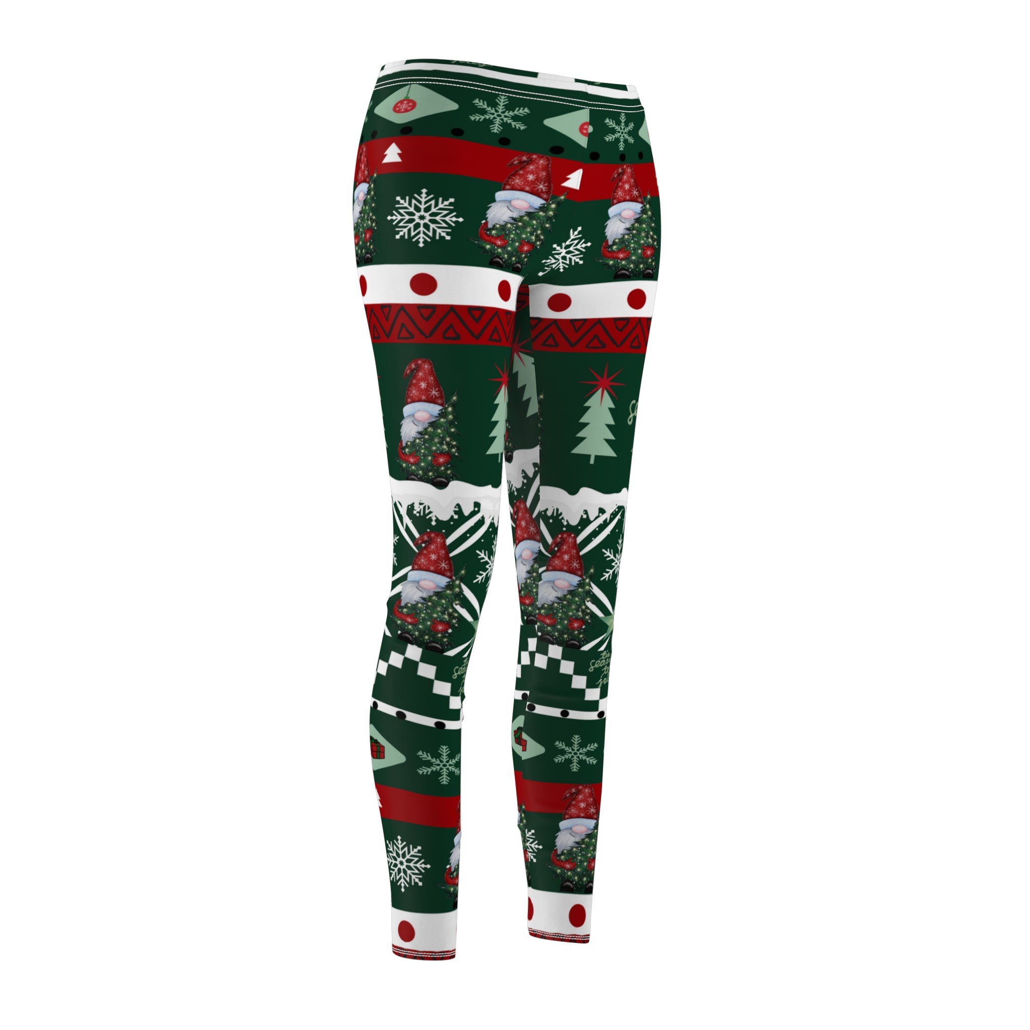 Introducing the "Tis' the Season To Be Jolly Gnome SuperSoft Casual Leggings" by Urban SoulShine & Co. These holiday leggings are crafted from luxuriously soft suede fabric and feature a festive pattern with snowflakes, Christmas trees, and gnomes in classic red, green, and white hues. The symmetrical design wraps playfully around your legs, reminiscent of the most stylish ugly Christmas sweater you've ever worn.