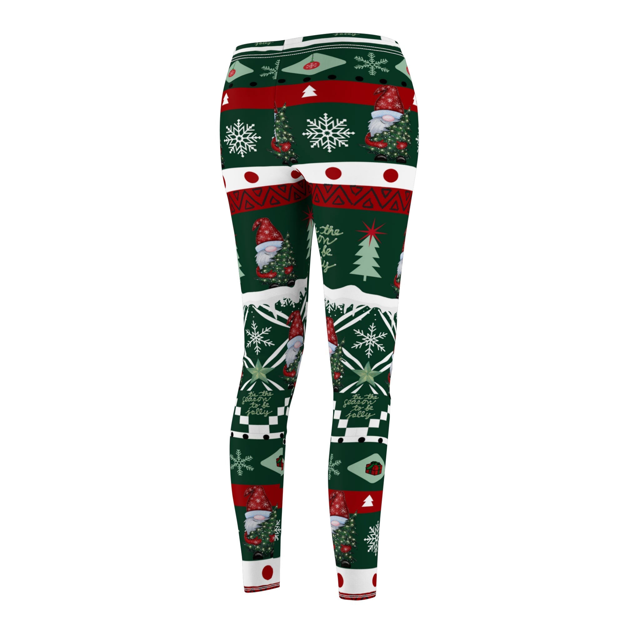 The back view of the Tis' the Season To Be Jolly Gnome SuperSoft Casual Leggings by Urban SoulShine & co showcases a festive Christmas design. Made from luxurious suede fabric, these leggings feature a lively combination of snowflakes, gnomes, trees, and geometric patterns in bold red, green, and white hues that evoke the charm of an ugly Christmas sweater.