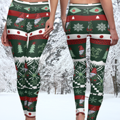 Two individuals wearing the Tis' the Season To Be Jolly Gnome SuperSoft Casual Leggings by Urban SoulShine & co stand side by side. These leggings, crafted from soft suede fabric, showcase cheerful patterns including snowflakes, gnomes, and Christmas trees in festive hues of red, green, and white. A snowy forest provides the picturesque backdrop to this cozy holiday scene.