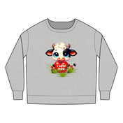 The Printify "I Love Moo - Cute Cow Toddler 2T-7T Crewneck Sweatshirt" is a gray top made from a soft cotton polyester blend. It features a cartoon cow with a heart, grass, flowers, and red hearts. It's CPSIA compliant for safety.