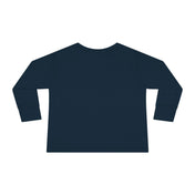 The Flippin' For Santa Christmas Dolphin Long Sleeve Toddler Tee by Urban SoulShine & co is displayed from the back against a white background. This dark blue unisex shirt is crafted from 100% cotton and features a simple design with a round neckline and straight hem.