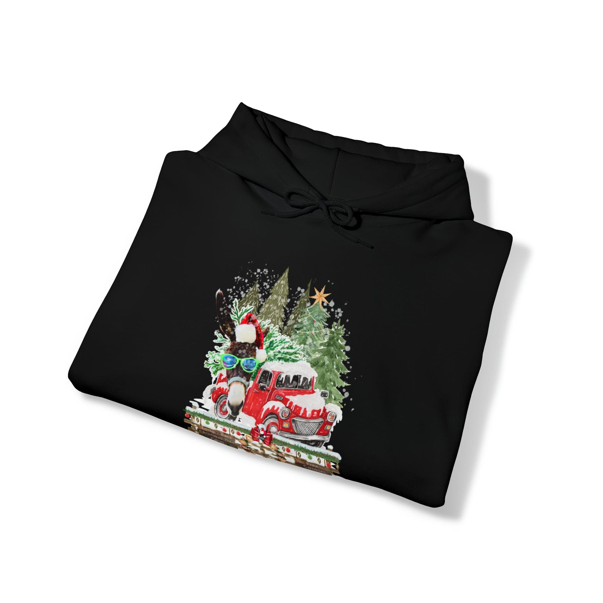 The Urban SoulShine & co Long Ears Christmas Tree Farm Donkey Claus Hoodie (unisex) in black features a cozy design with a red truck carrying a Christmas tree and gifts, surrounded by snowflakes and festive decorations, perfect for embracing the holiday spirit.