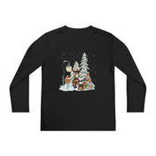 Urban SoulShine & co's Donkey Claus Street Player Christmas Long Sleeve Competitor Tee (Youth Unisex) is a black shirt with a festive design of a cheerful bear playing a trumpet next to a decorated tree, streetlamp, gifts, and falling snowflakes. With PosiCharge moisture-wicking technology, it ensures you stay comfortable during all your holiday activities.