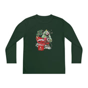 The YEE HAW Donkey Claus Long Sleeve Competitor Tee (Youth Unisex) by Urban SoulShine & co is a green, moisture-wicking athletic-fit shirt featuring a graphic of a Christmas tree sipping from a straw in a red wagon, with the text "Yipee Kiyay" above. Snowflakes and a Santa-themed "Seasons Greetings" bag complement this stylish design enhanced with PosiCharge technology.