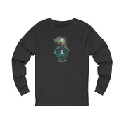 The Good Tidings Great Joy Christmas Wish Glowing Long Sleeve Tee (Unisex) from Urban SoulShine & co features a festive Christmas design showcasing a stunning fireworks motif, along with the phrases "Good Tidings of Great Joy" and "Luke 2:10.