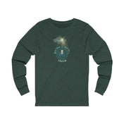 Urban SoulShine & co presents the "Good Tidings Great Joy Christmas Wish Glowing Long Sleeve Tee," a unisex design in green. It features a festive wreath and the text "Good Tidings of Great Joy, Luke 2:10" in white, accented with sparkles and stars for a light projection effect that perfectly embodies the seasonal spirit.