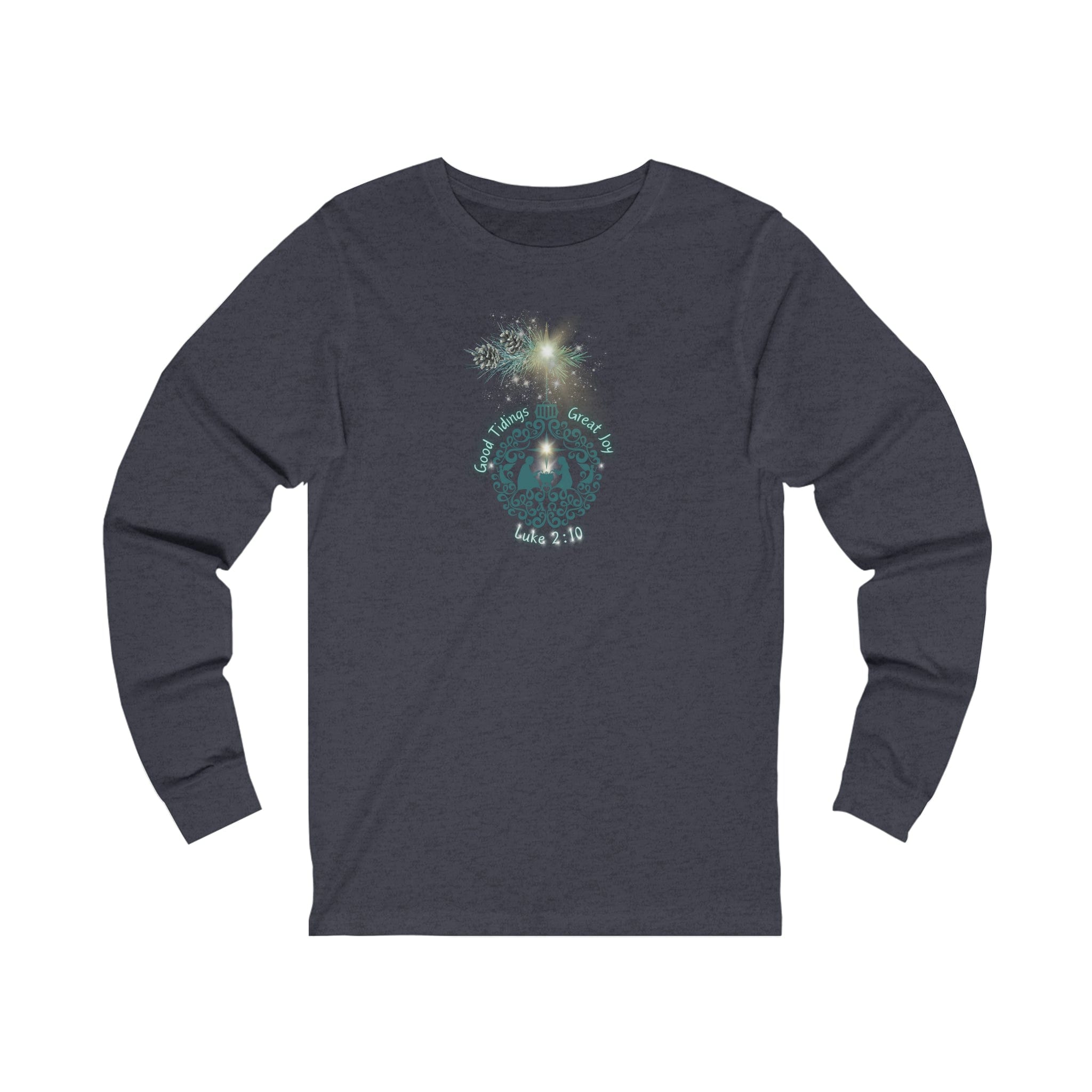 The Urban SoulShine & co Good Tidings Great Joy Christmas Wish Glowing Long Sleeve Tee for both men and women showcases a lively Christmas design. Fireworks are displayed at the top, while a wreath surrounds the phrase "Good Tidings of Great Joy" with "Luke 2:10.