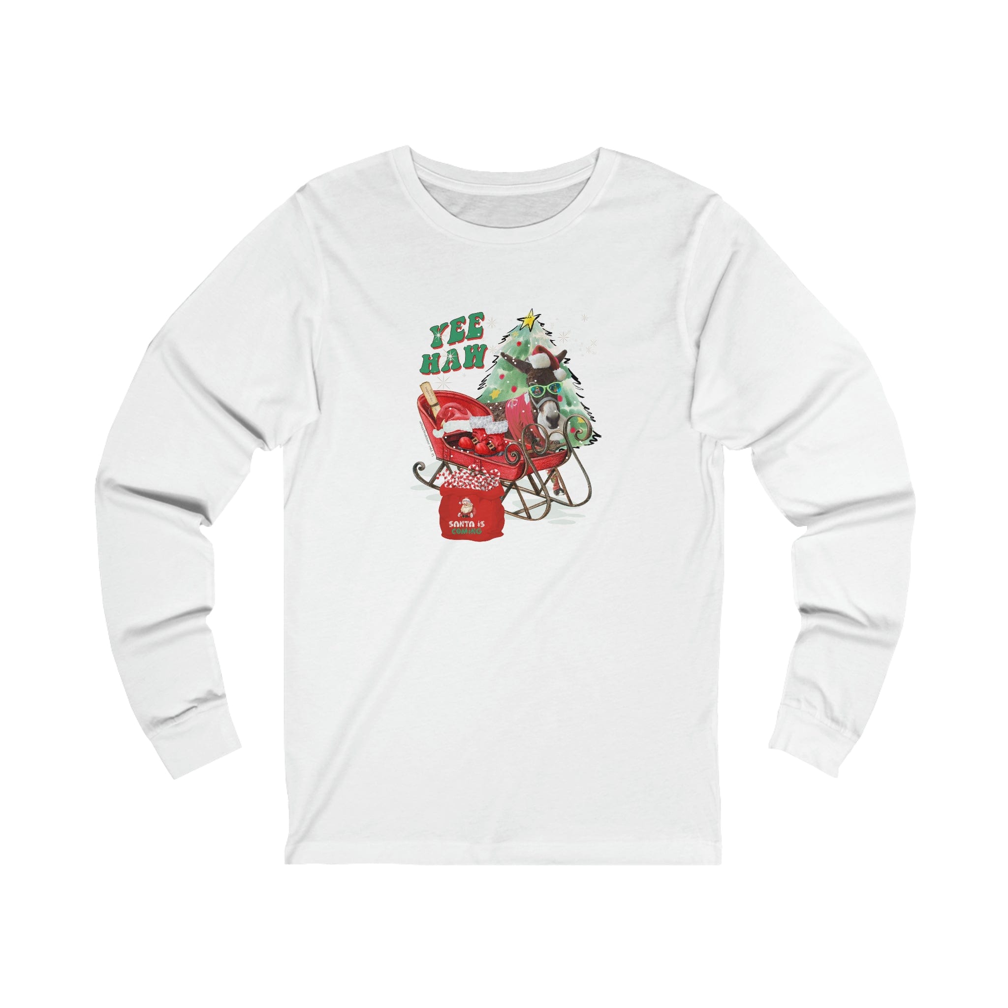 The YEE HAW Santa Is Coming Donkey Claus Long Sleeve Tee by Urban SoulShine & co is a white unisex jersey shirt showcasing a festive design with a dinosaur wearing a Santa hat in a sleigh full of gifts. It features "YEE HAW!" in green and red letters above the image, making it ideal for the holiday season.