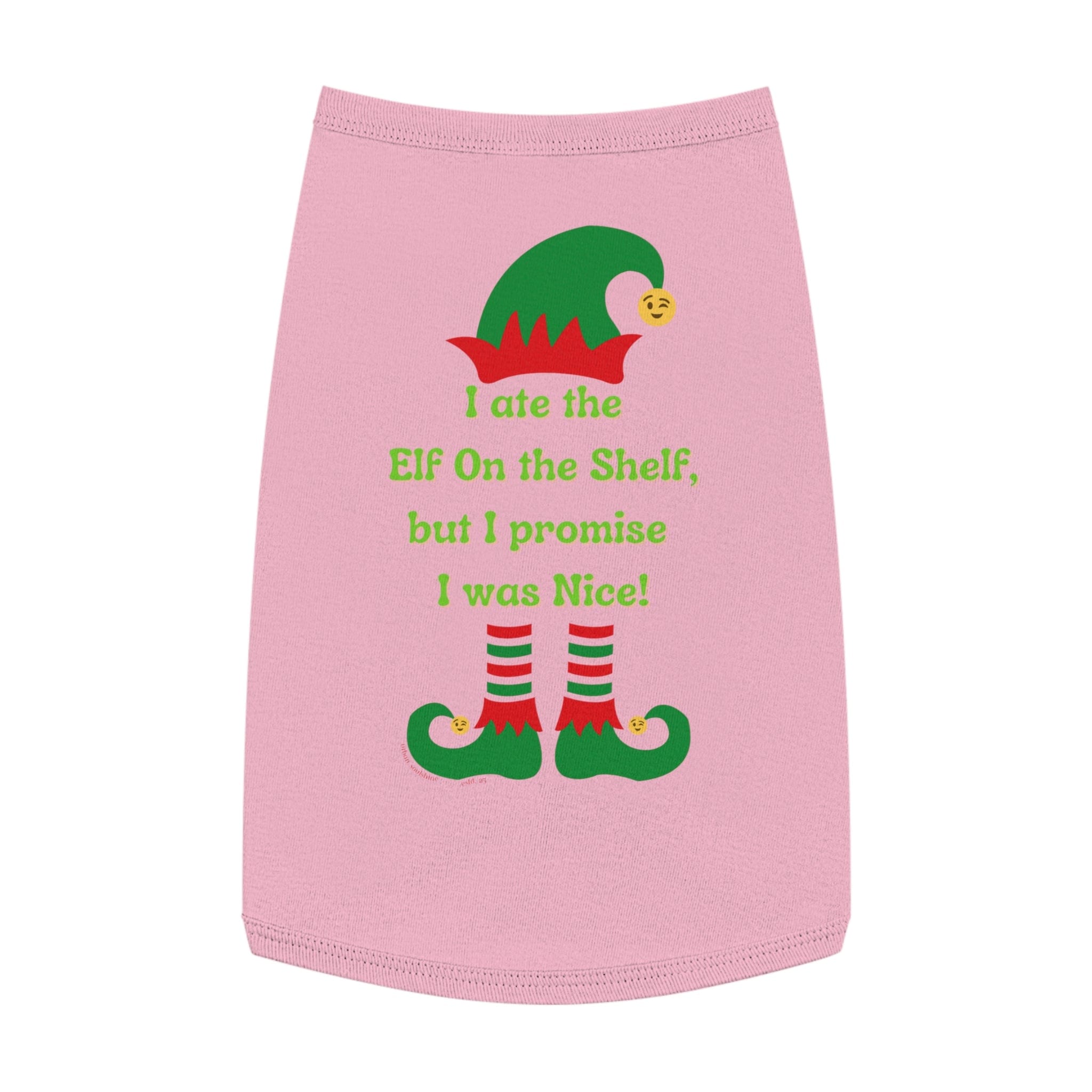 Introducing the Urban SoulShine & co "I Ate the Elf On the Shelf Holiday Pet Shirt": a delightful pink pet shirt adorned with a festive design of a green elf hat and shoes. The text playfully proclaims, "I ate the Elf on the Shelf, but I promise I was Nice!" in cheerful green and red lettering. To top it off, this charming piece is machine wash safe for your convenience.