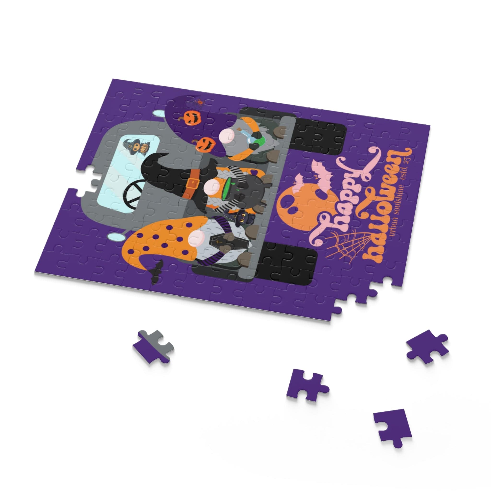 The Farm Truck Gnomes Halloween Puzzle by Urban SoulShine & co is a 120-piece Halloween-themed jigsaw made from premium chipboard. It showcases a purple background with costumed gnome characters and "Happy Halloween" in bright orange. Scattered pieces encircle the main portion, all elegantly packaged in a gift-ready box for festive enjoyment.