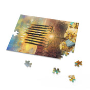 The Menorah Miracles Hanukkah Jigsaw Gift Puzzle, available in 120, 252, or 500 pieces from Urban SoulShine & Co., illustrates a lit menorah against a vibrant background with scattered coins. Loose puzzle pieces rest nearby on a white surface, making it an ideal holiday gift for puzzle enthusiasts.